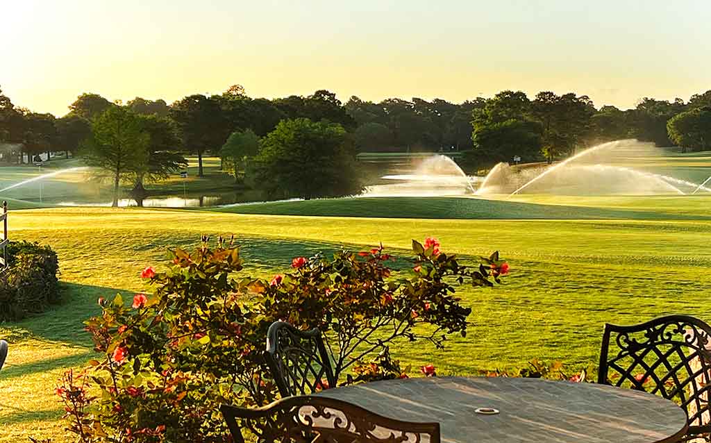 Green and water feature at the Oakhurst golf course in Kingwood, Texas